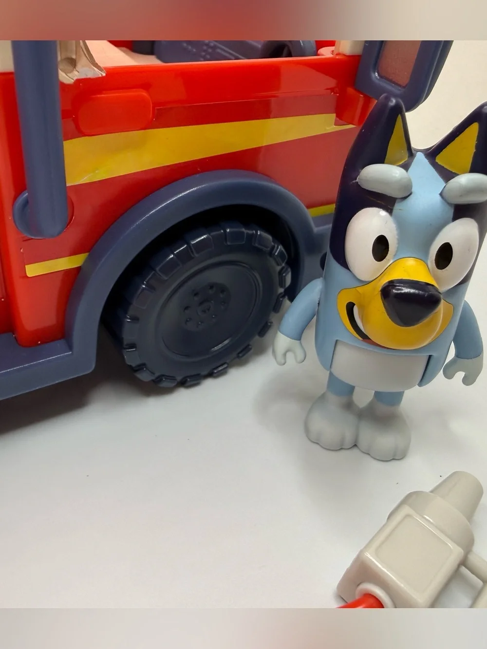 Disney Bluey fire truck playset toy with bingo bluey figure